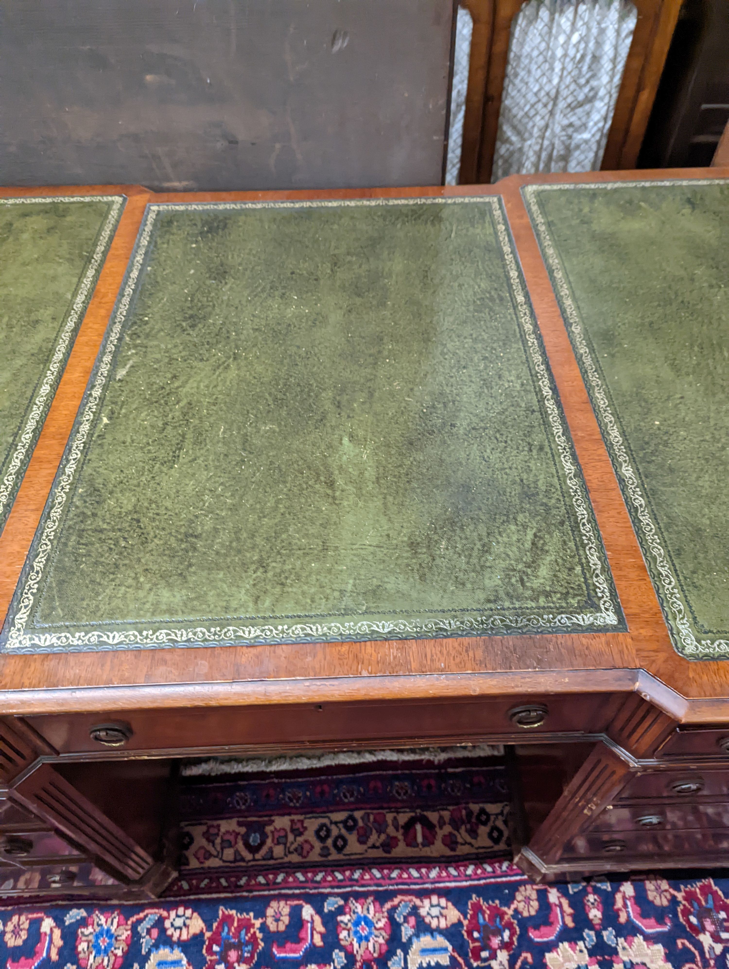 A reproduction George III style mahogany pedestal desk, length 150cm, depth 90cm, height 76cm